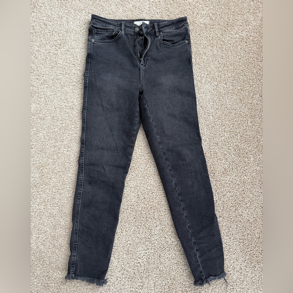Free People black skinny jeans with raw hem